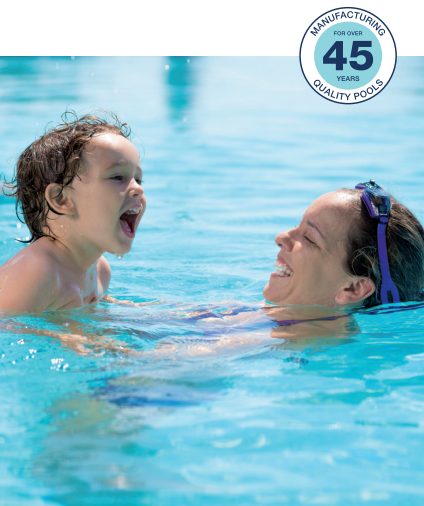 Mother and child joyfully playing in the pool.